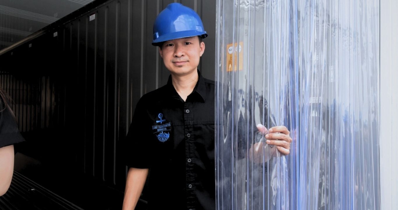 Cold chain logistics facility interior and staff handling cargo